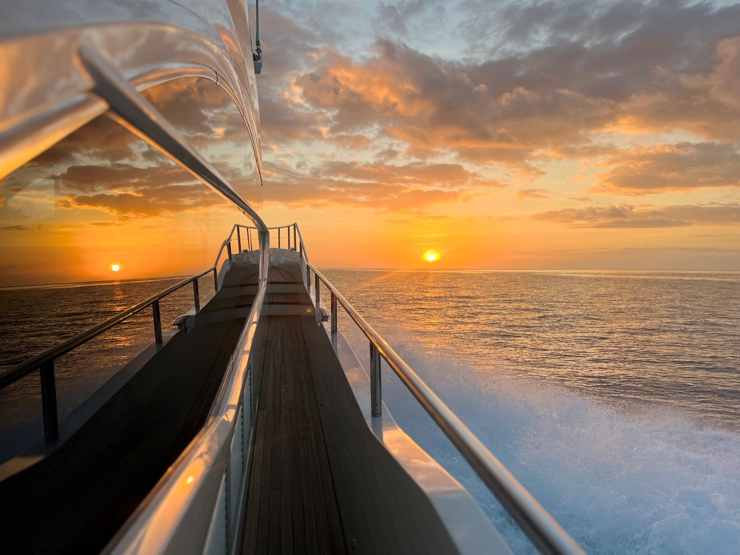 View from the deck of a motor yacht at sunset